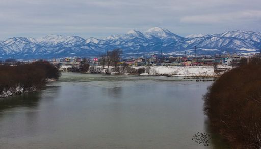 Snowy mountains in the background at Otaru-Shi - Minatomachi, Hokkaido, Japan