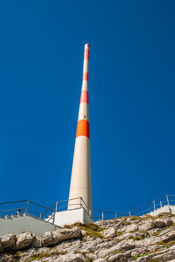A view of an energy tower in white and orange near the area of Santis Schwagalp Mountain, Switzerland