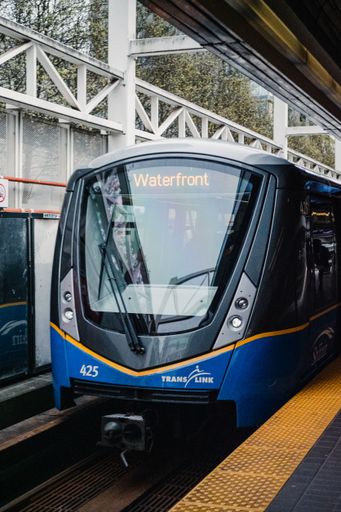 A modern Subway Train with reflecting glass on the platform in the station in Vancouver city, Canada