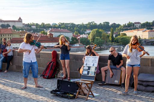 A closeup of Street musicians playing in Prague on Charles bridge in the Czech Republic