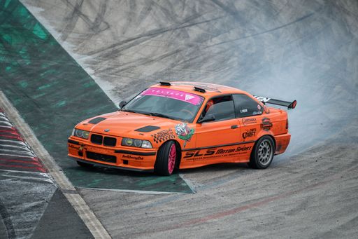 Orange Bmw E36 drift at the Navarra circuit