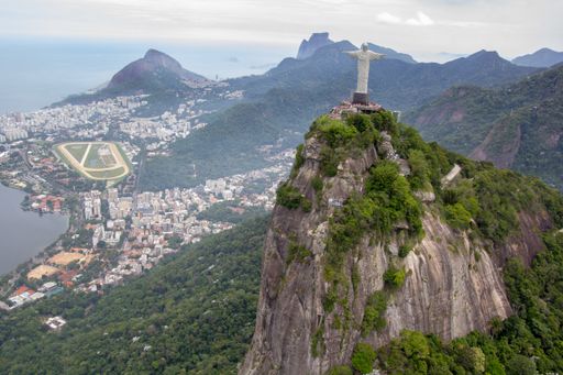 AN aerial shot of the amazing Rio de Janeiro's cityscape with visible statue of Christ the Redeemer