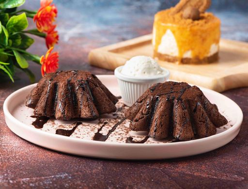 A closeup of chocolate cakes on a white plate