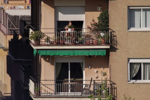 People on balcony during COVID-19 confinement in Barcelona,Spain. Coronavirus Social Distancing