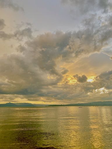 A vertical shot of a beautiful sea during the sunset