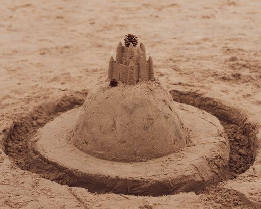 A closeup of a sandcastle with moist found at Formby beach