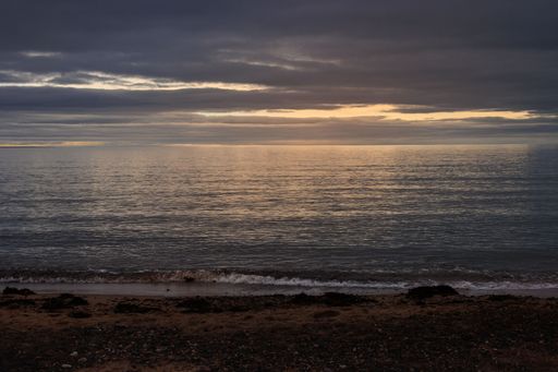 A mesmerizing view of the golden sunset over the sea