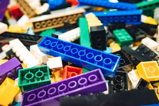 A closeup shot of a pile of colorful children's building block toys