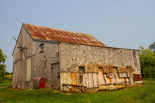 An old wooden barn in a field