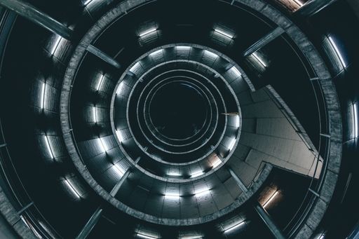 A high angle shot of a spiral ladder with lights - perfect for a cool background