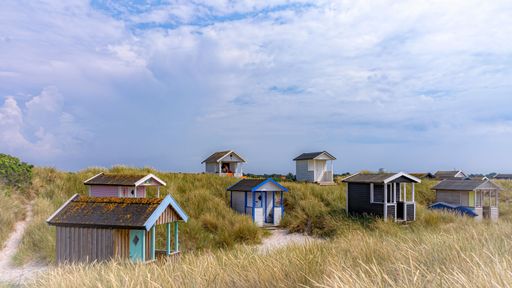A beautiful shot of small huts at the beach in Skanor, Skane County, Sweden