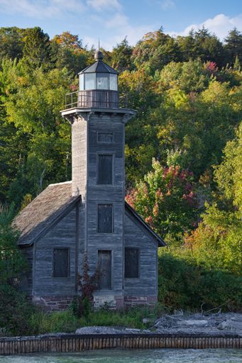 A vertical shot of the historic East Channel Lighthouse on Grand Island in Munising Bay, Lake Superior, Michigan