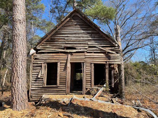 Louisville, Ga USA - 02 10 22: Old crumbling wooden dilapidated building front view