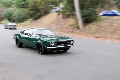 A classic Chevrolet Camaro car driving in the road in motion blur in Los Angeles, California, United States