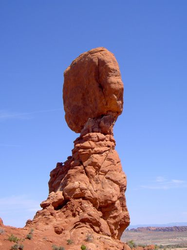 A vertical shot of Balanced Rock against blue sky in the Arches National Park, Utah, USA