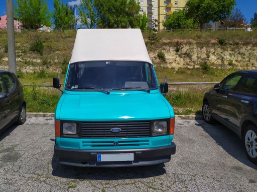 A Ford Transit motorhome Van parked on a street