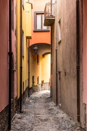 A beautiful shot of a narrow historical street in the afternoon