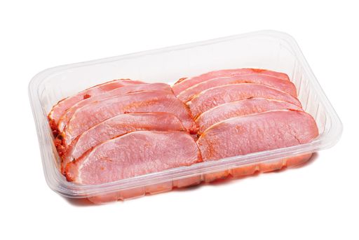 Marinated pork loin in plastic container isolated on white