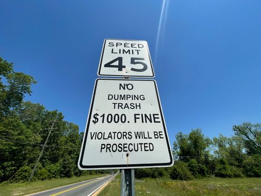 Augusta, Ga USA - 04 02 22: Street traffic signs speed limit 45 No trash dumping front view