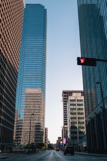 An intersection surrounded by skyline buildings in Downtown Dallas
