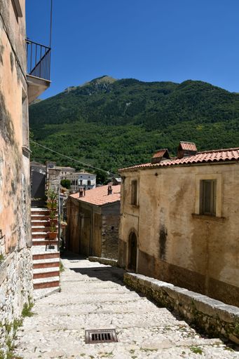A narrow street in the village of San Donato Val di Comino on a sunny day near Rome, Italy