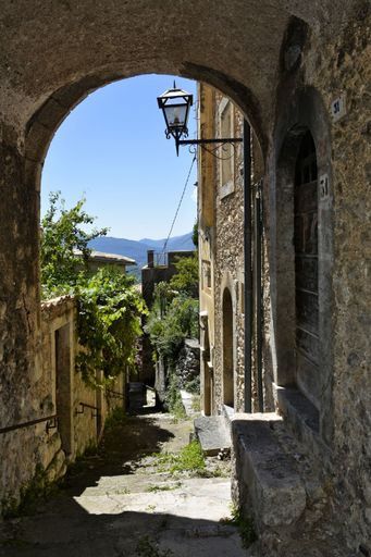 A vertical shot of a narrow street in San Donato Val di Comino - a village near Rome, Italy