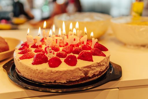 A closeup shot of a birthday cake with candles