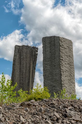A view of two vertical stone monuments at the Black Mountains outdoor museum at Hagghult, Sweden