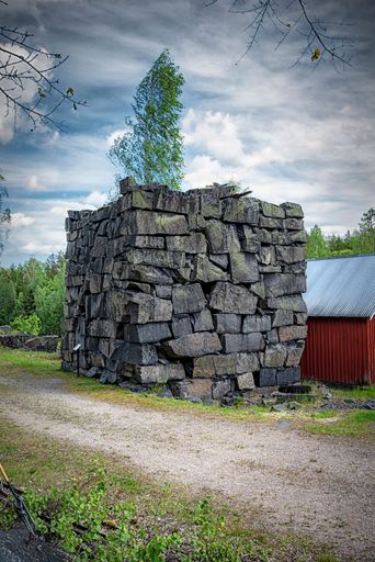 A rectangular stone monument at the Black Mountains outdoor museum at Hagghult, Sweden