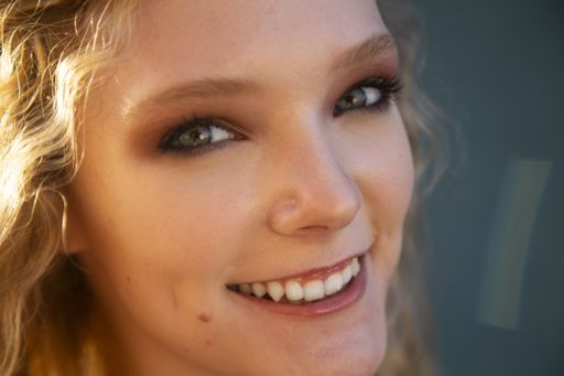 A closeup shot of a young smiling female