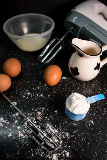 A view of flour and eggs on a kitchen table prepared for baking something delicious