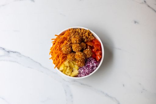 The top view of a bowl of Mahalo poke -healthy salad with veggies
