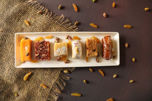 A top view of different pastry served on a white plate on a table