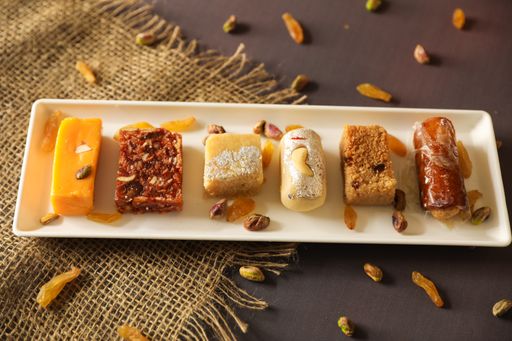 A top view of different pastry served on a white plate on a table