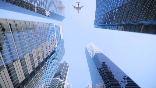 A Low angle shot of an airplane flying above modern skyscrapers