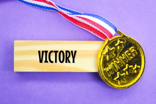 pedals and wooden boards with the word victory Concept