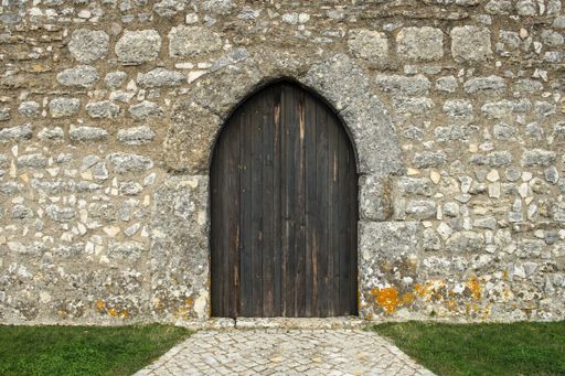 A closeup shot of a wooden door into an old building - perfect for background