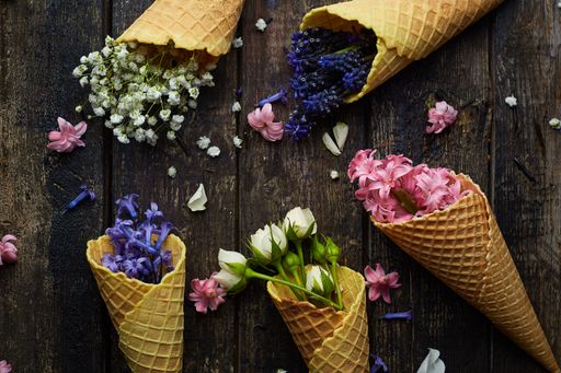 waffles for ice cream with flowers on a black background