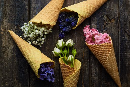 waffles for ice cream with flowers on a black background