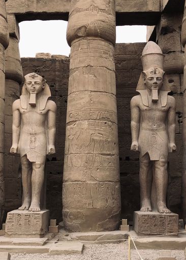 A vertical shot of Egyptian statues at the entrance to the Temple of Amun-Re at Karnak, Luxor, Egypt