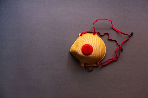 A top view shot of ffp2 respirator mask isolated on a gray background