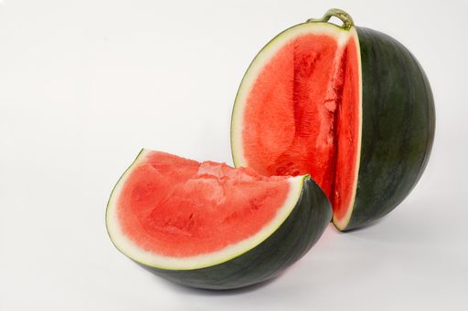 A closeup shot of a watermelon isolated on white background