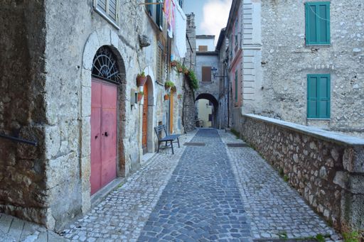 A narrow street with old houses in Guarcino, a village near Rome, Italy