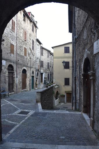 A narrow street with old houses in Guarcino, a village near Rome, Italy