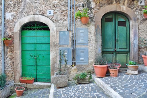 A narrow street with old houses in Guarcino, a village near Rome, Italy