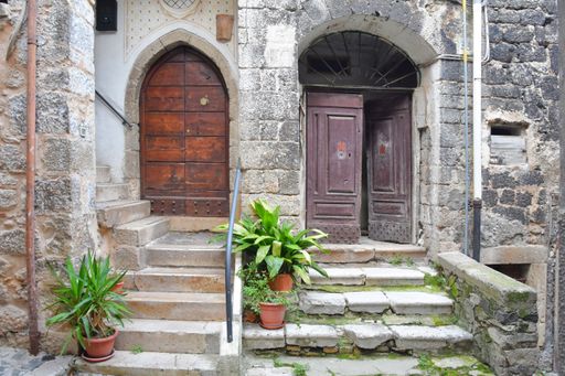 A narrow street with old houses in Guarcino, a village near Rome, Italy