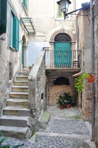 A narrow street with old houses in Guarcino, a village near Rome, Italy