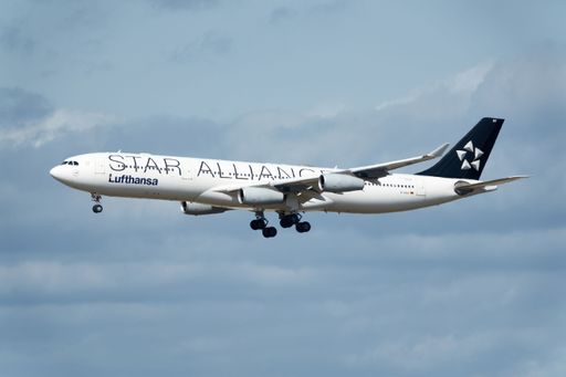 In flight shot of an Star Alliance Airbus A340 airplane approaching Frankfurt International Airport, Germany.