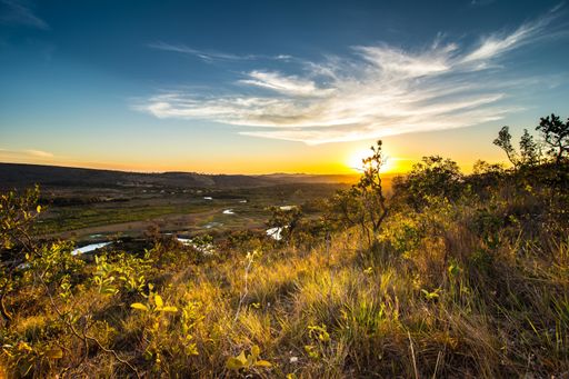 A beautiful grassland with hills during a sunset in Serra do Cipo National Park in Brazil