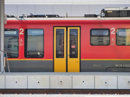 A colorful empty train with closed doors